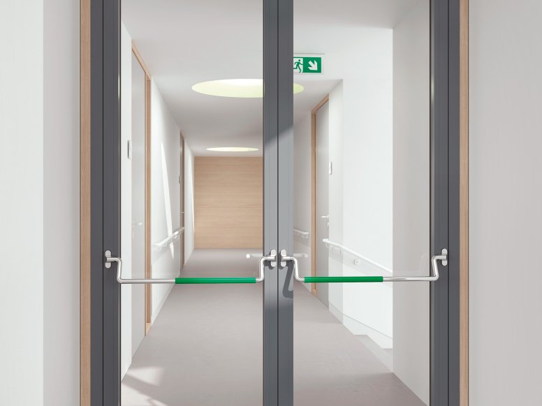 Double glass door equipped with two stainless steel panic bars with green polyamide handle tube