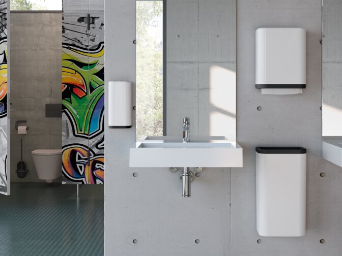 Washbasin of a school toilet equipped with soap and paper towel dispenser in signal white made of polyamide